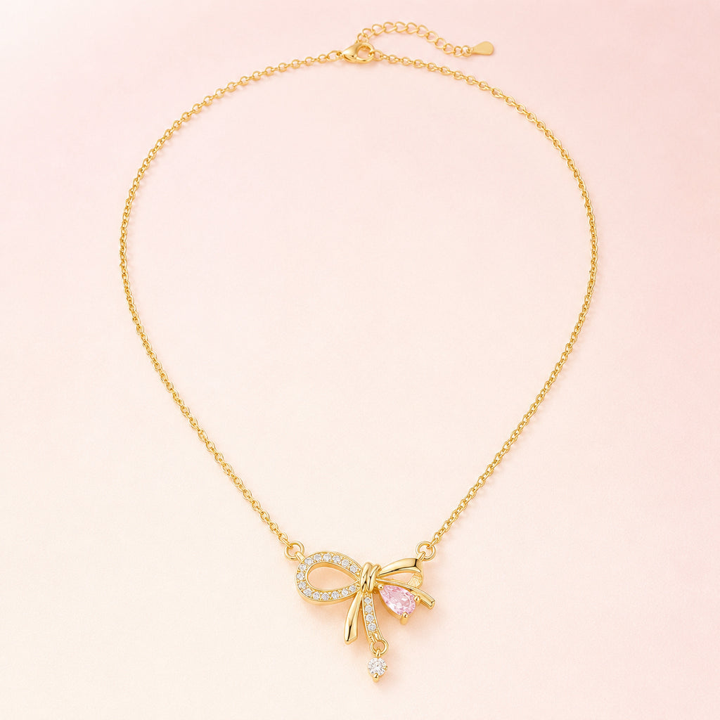 Collar con lazo Juliette Gold – Collar con dije de cinta de cristal rosa